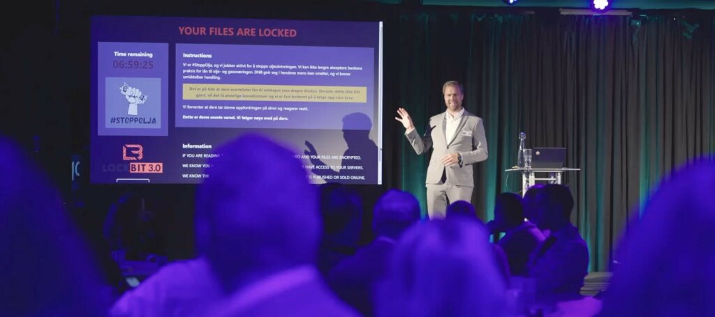 A room of participants during a live cybersecurity training exercise.