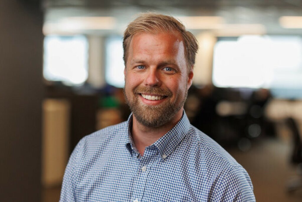 Headshot of Erlend smiling at the camera.